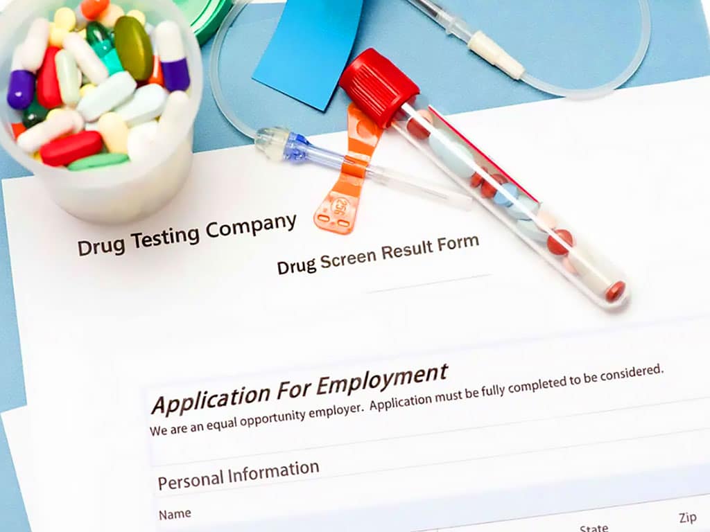 A drug test result file underneath an application form