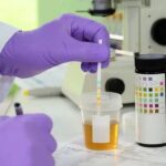 A person testing a urine specimen