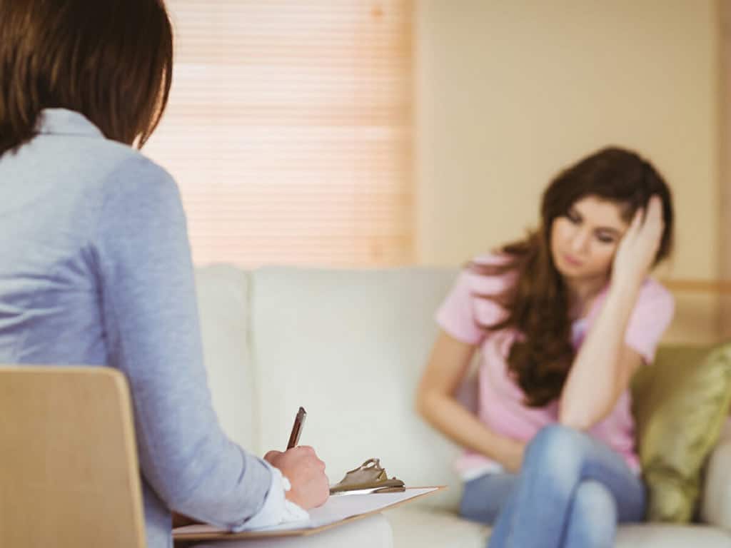 A counsellor doing an interview to a patient
