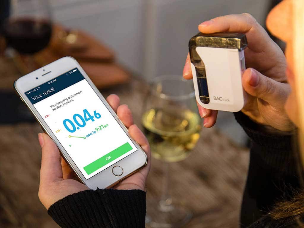 A breathalyzer connected to a smartphone
