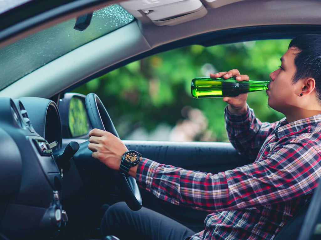 A man drinking while driving
